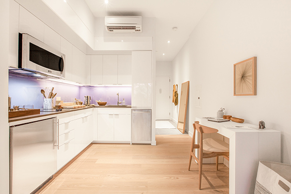 first class kitchen at the Ollie in NYC. Space saving measures in the micro unit bedroom and living room allow for a kitchen that feels full size